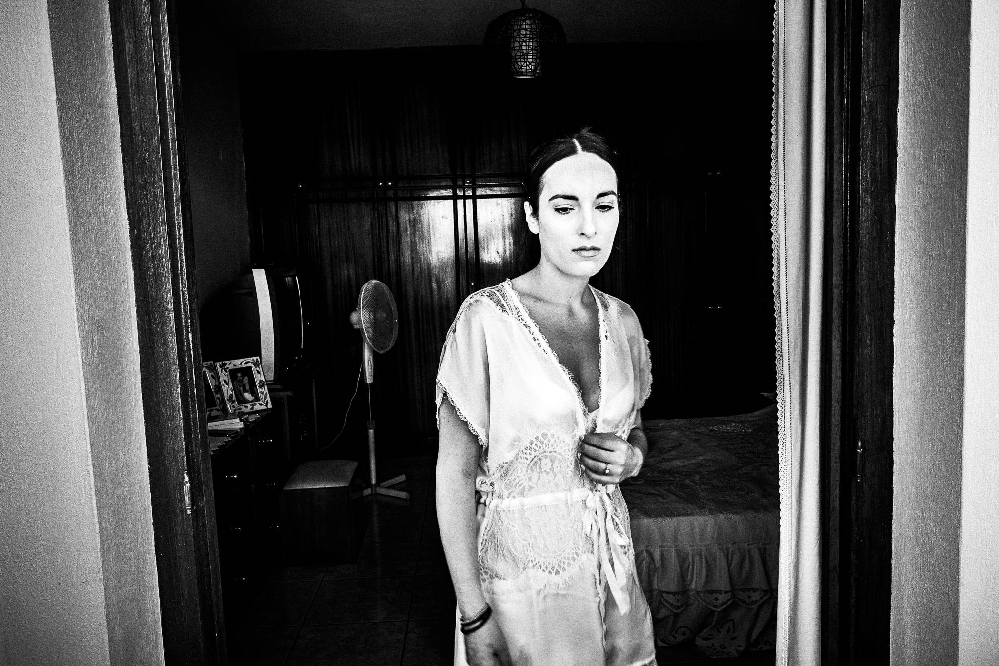 The bride about to get ready at a traditional wedding at Olympos, Karpathos, Greece. Black and white photography by George Tatakis