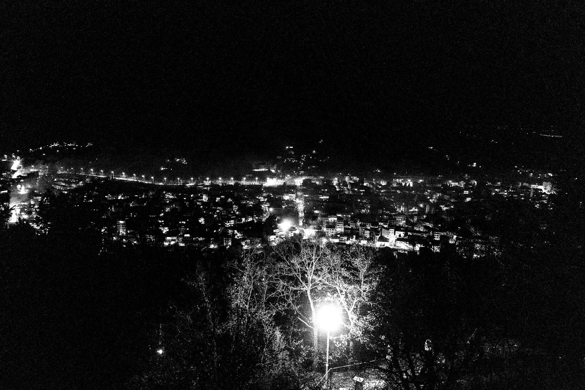 View of Florina atop a hill, Pagan Christmas customs of Northern Greece, by photographer George Tatakis
