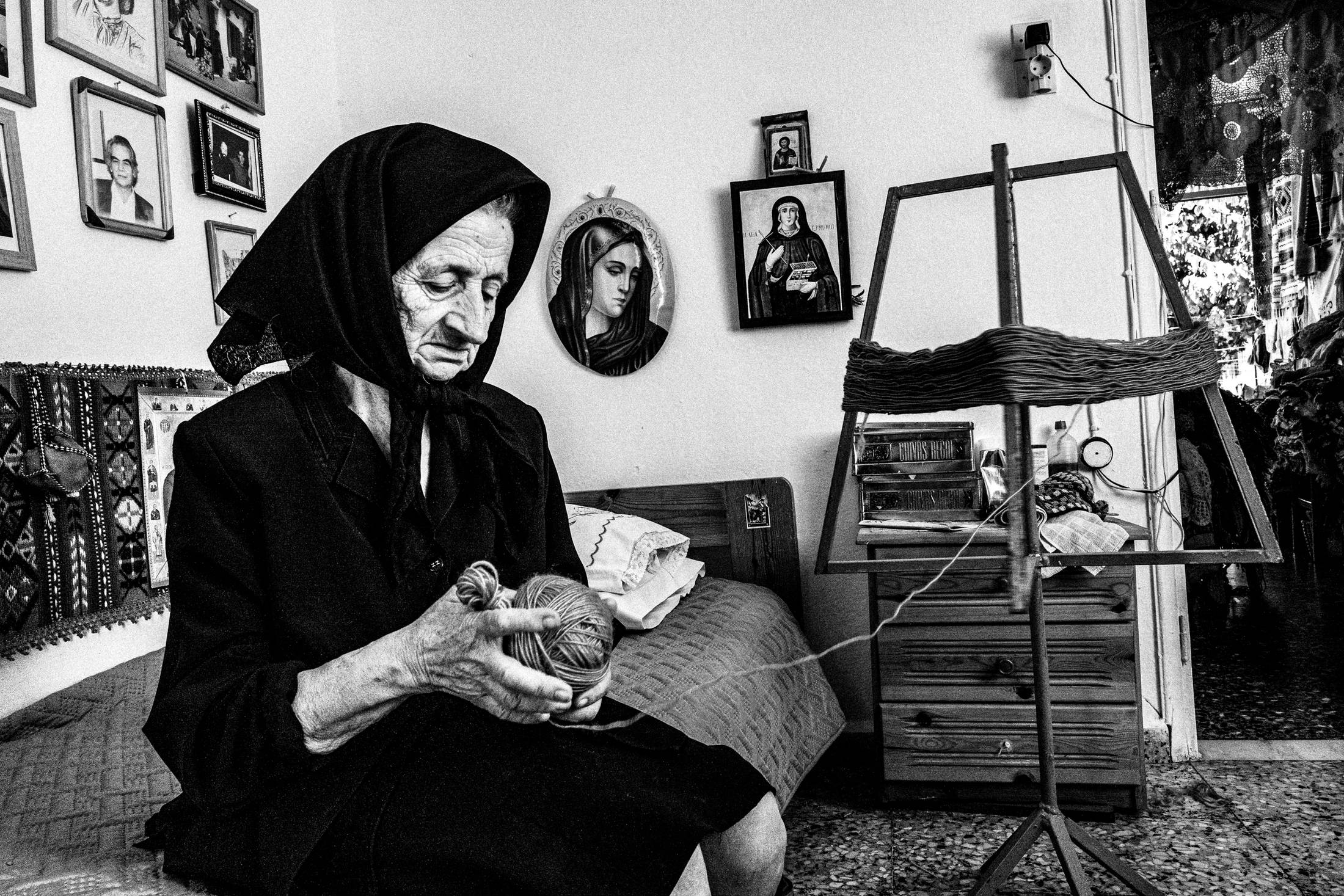 Hermione at her shop in Anogia, Rethymnon, Crete, by photographer George Tatakis