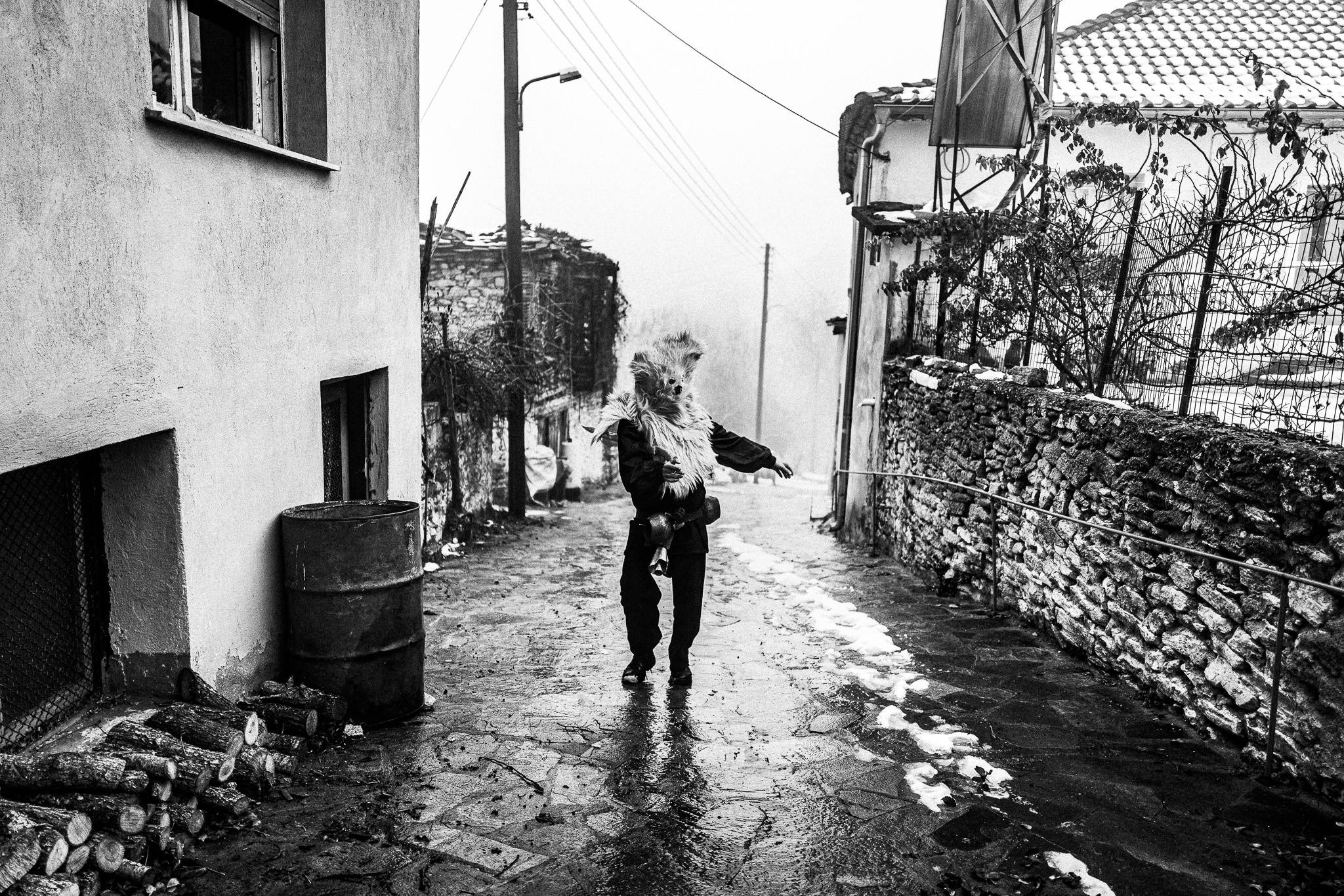 A Charapis dancing at Pagoneri, Pagan Christmas customs of Northern Greece, by photographer George Tatakis