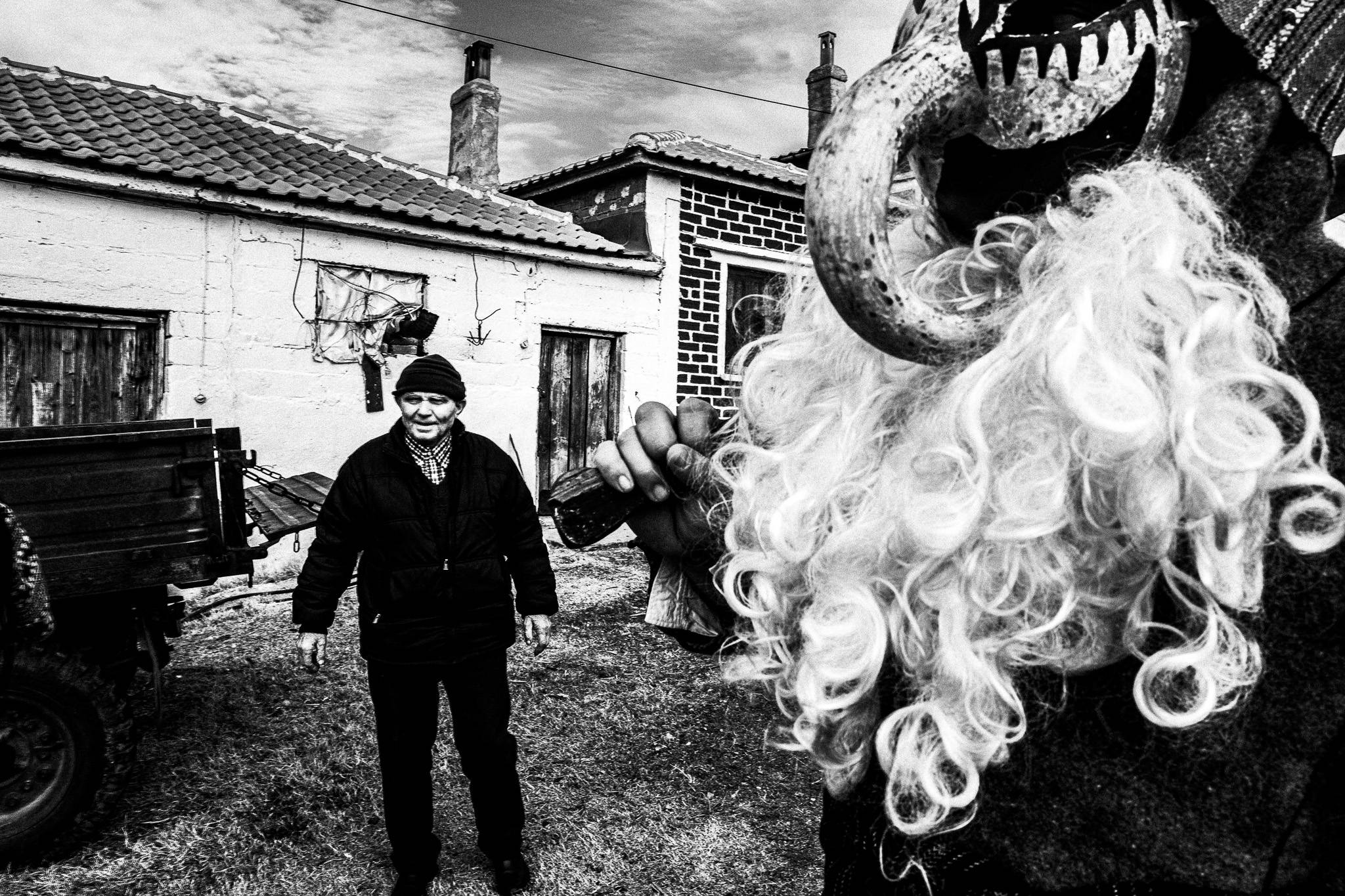 Purpuris visiting houses, Pagan Christmas customs of Northern Greece, by photographer George Tatakis