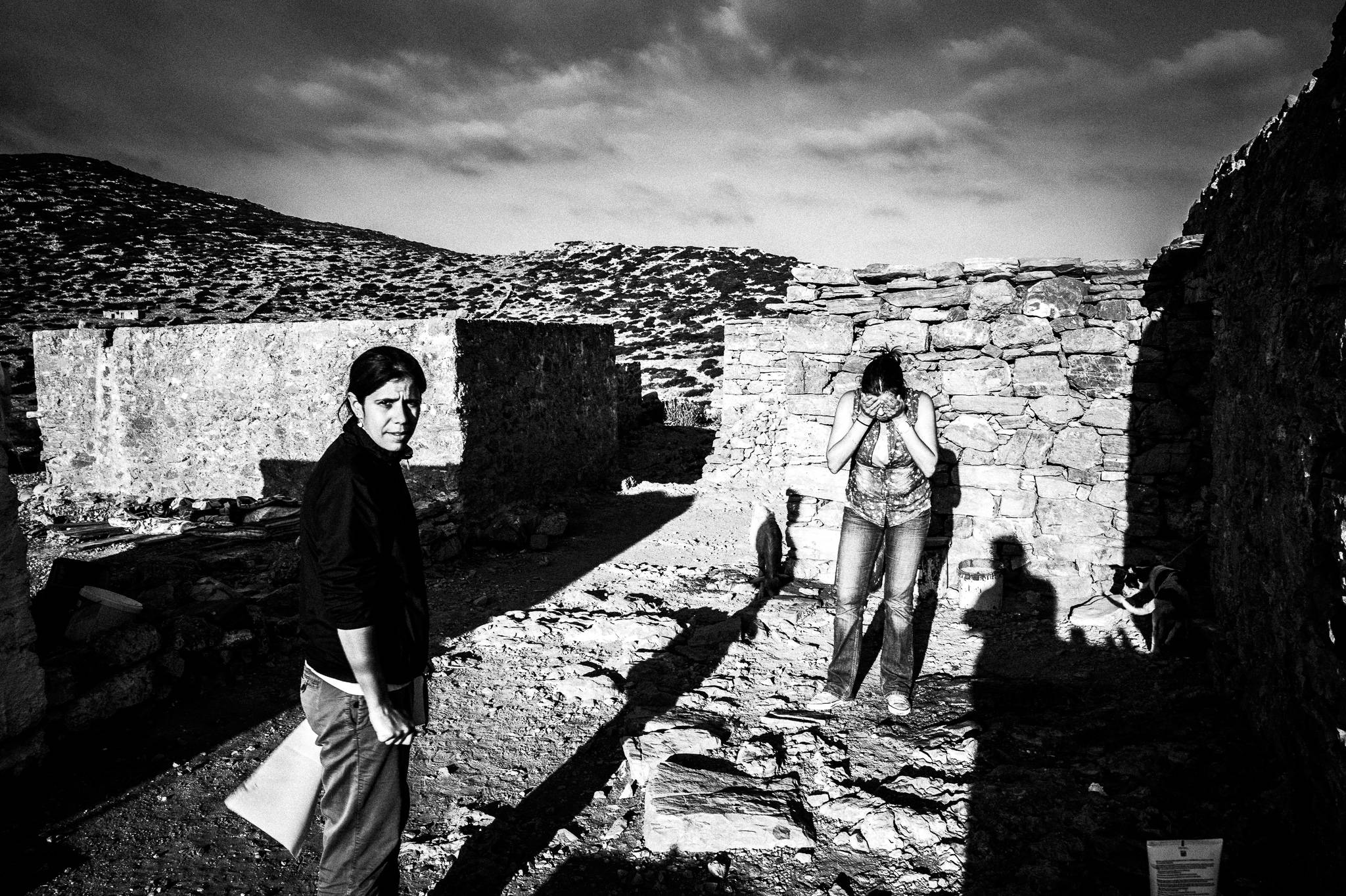 Washing up in the morning at the festival of St. Zacharias at Argos on the island of Saria, Olympos, Karpathos, Greece. Black and white photography by George Tatakis