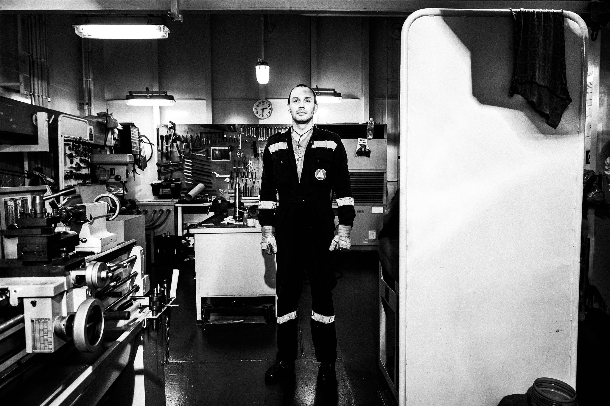 Oiler in engine workshop by photographer George Tatakis