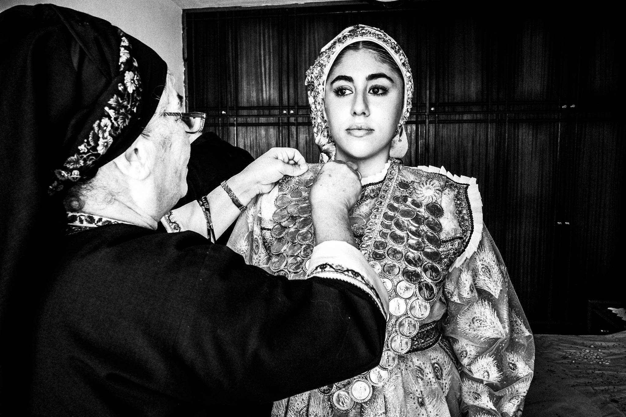 A friend of the bride at Olympos, Karpathos, Greece. Black and white photography by George Tatakis