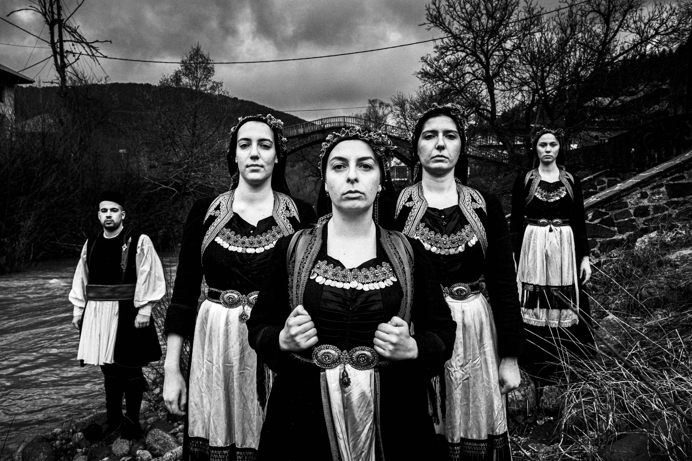 Vovousa, Eastern Zagori, Epirus, Greece. The local costumes overlooking the river. Photography by George Tatakis.