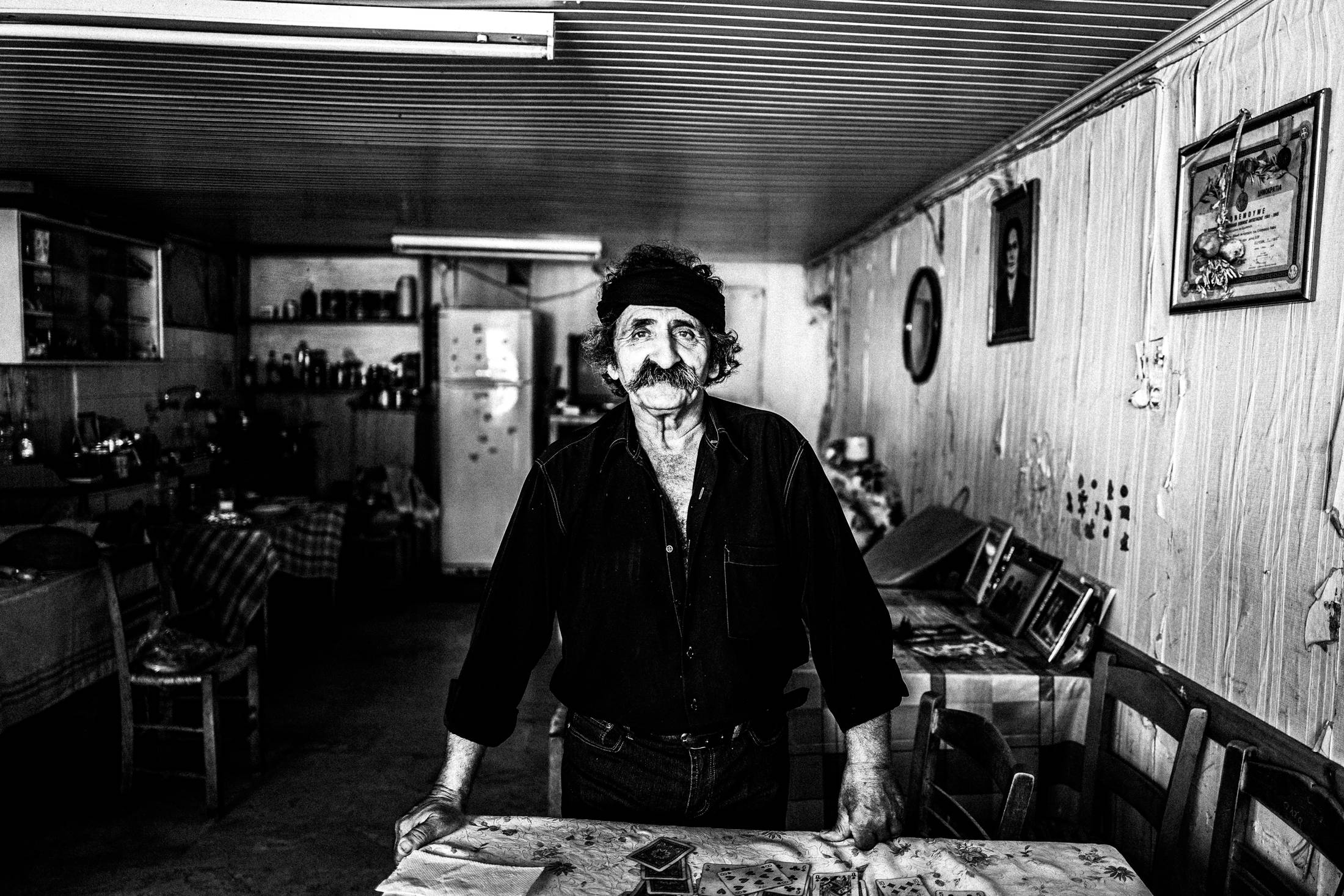 Lefteris inside his café in Anogia, Rethymnon, Crete, by photographer George Tatakis