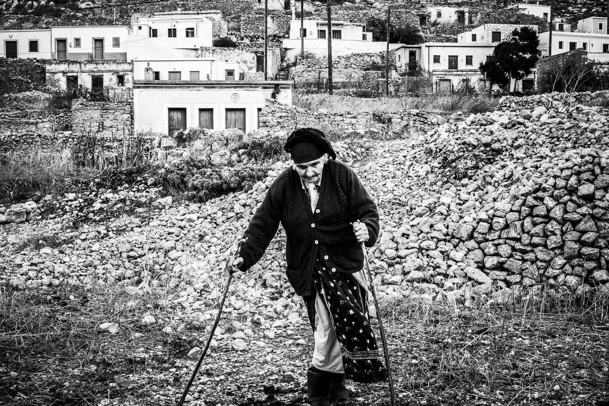 Old lady in Avlona, Olympos, Karpathos, Greece. Black and white photography by George Tatakis