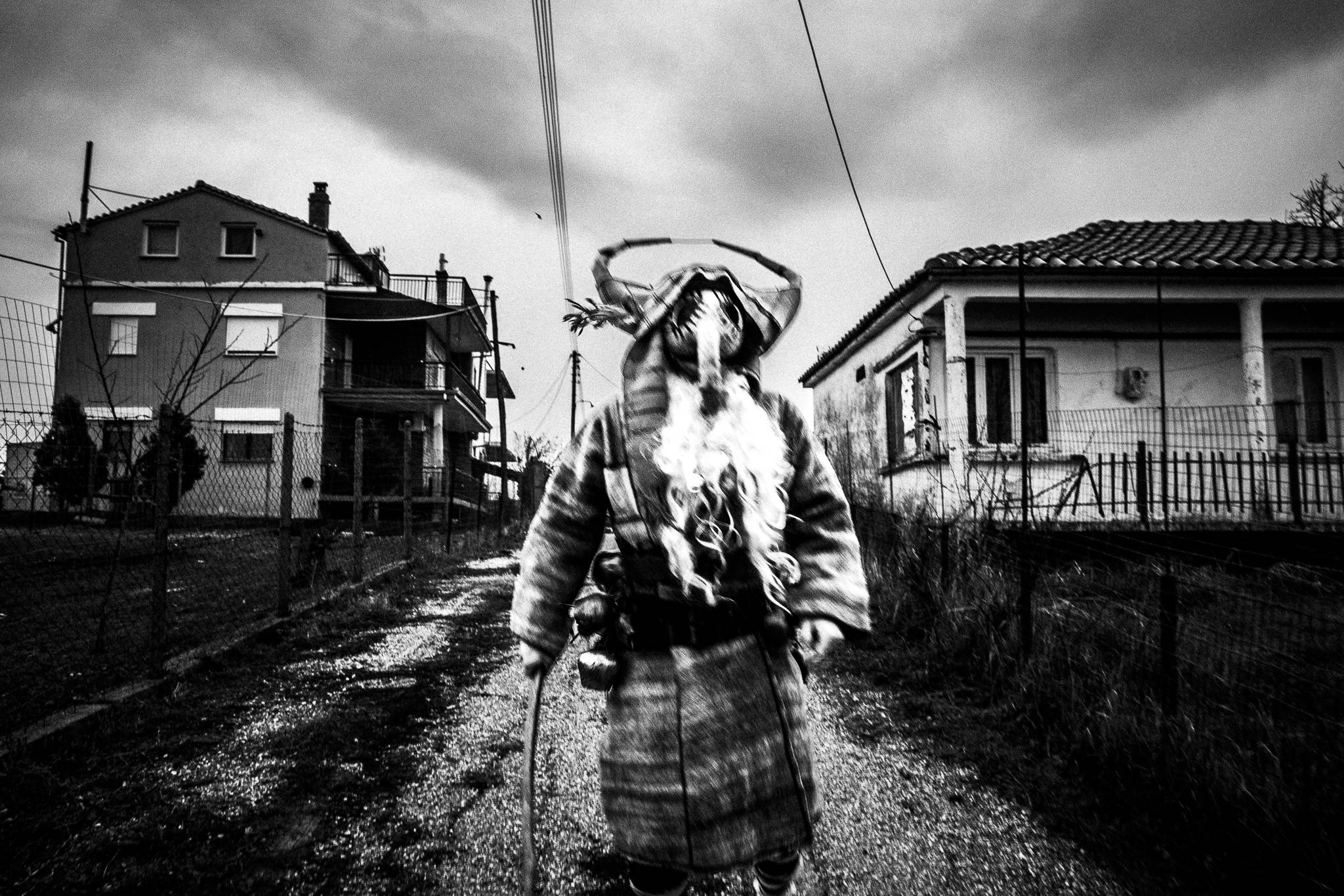 Purpuris running around Issaakion, Pagan Christmas customs of Northern Greece, by photographer George Tatakis