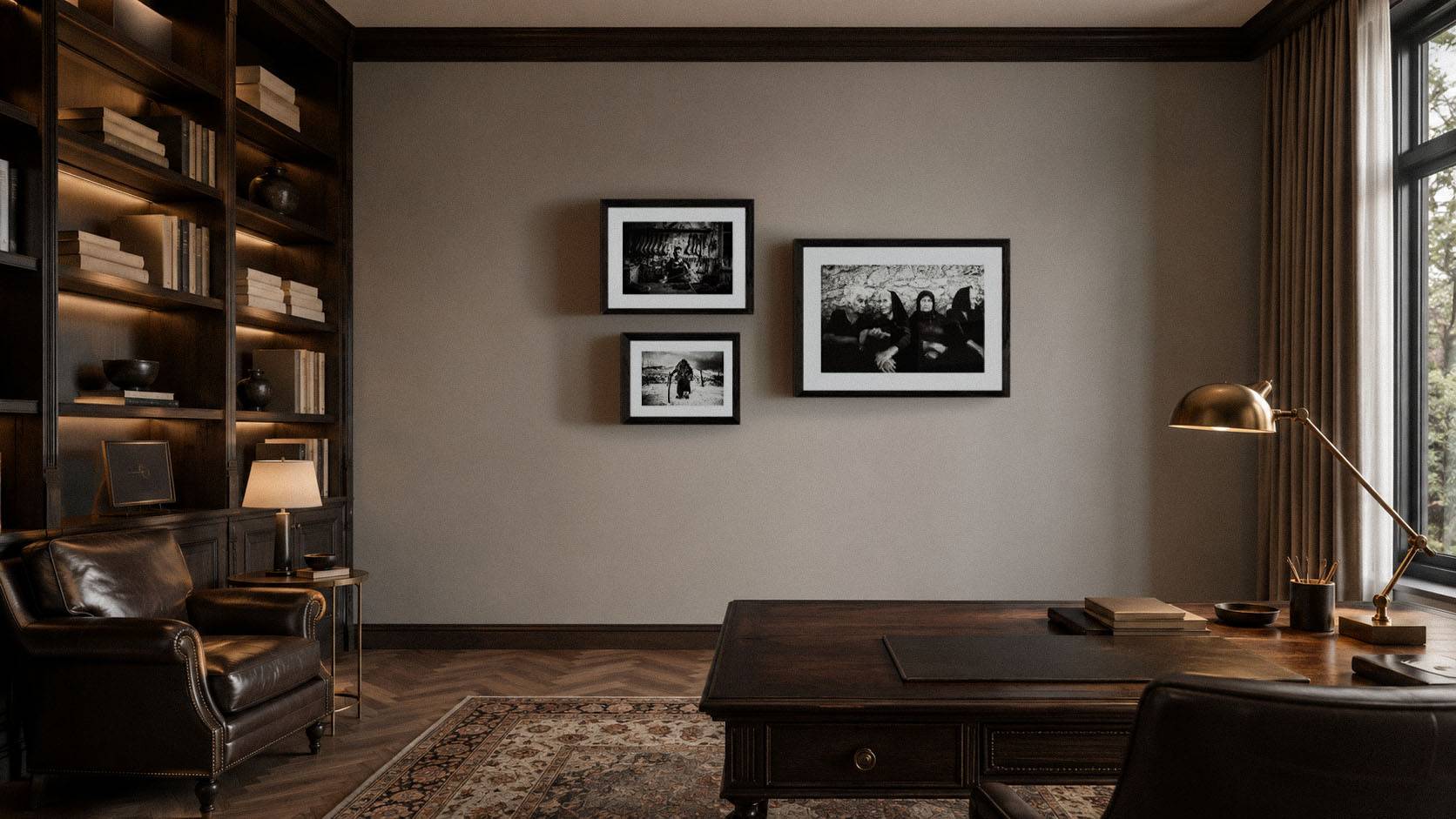 Collection of framed black-and-white fine-art photographs displayed in a refined study interior, demonstrating gallery-style presentation and archival framing.
