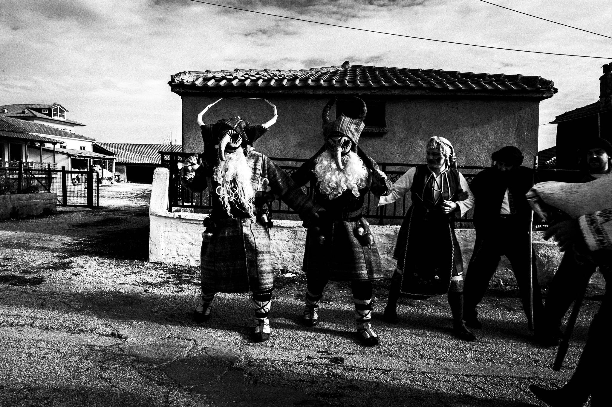 Dancing a traditional circular dance, Pagan Christmas customs of Northern Greece, by photographer George Tatakis