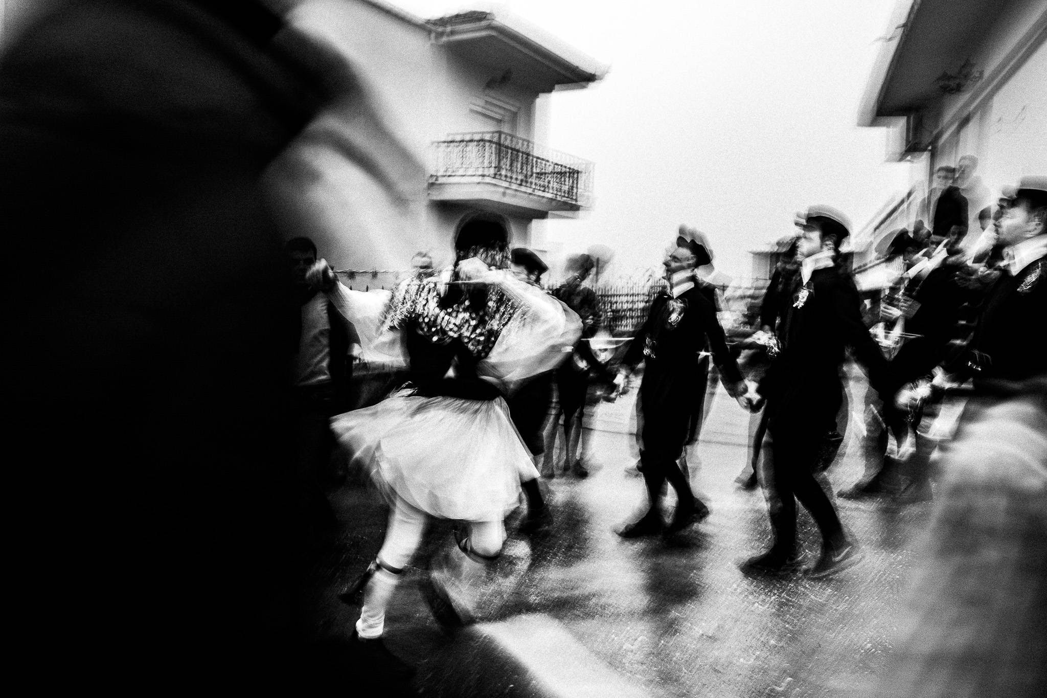 Dancing at houses, Pagan Christmas customs of Northern Greece, by photographer George Tatakis