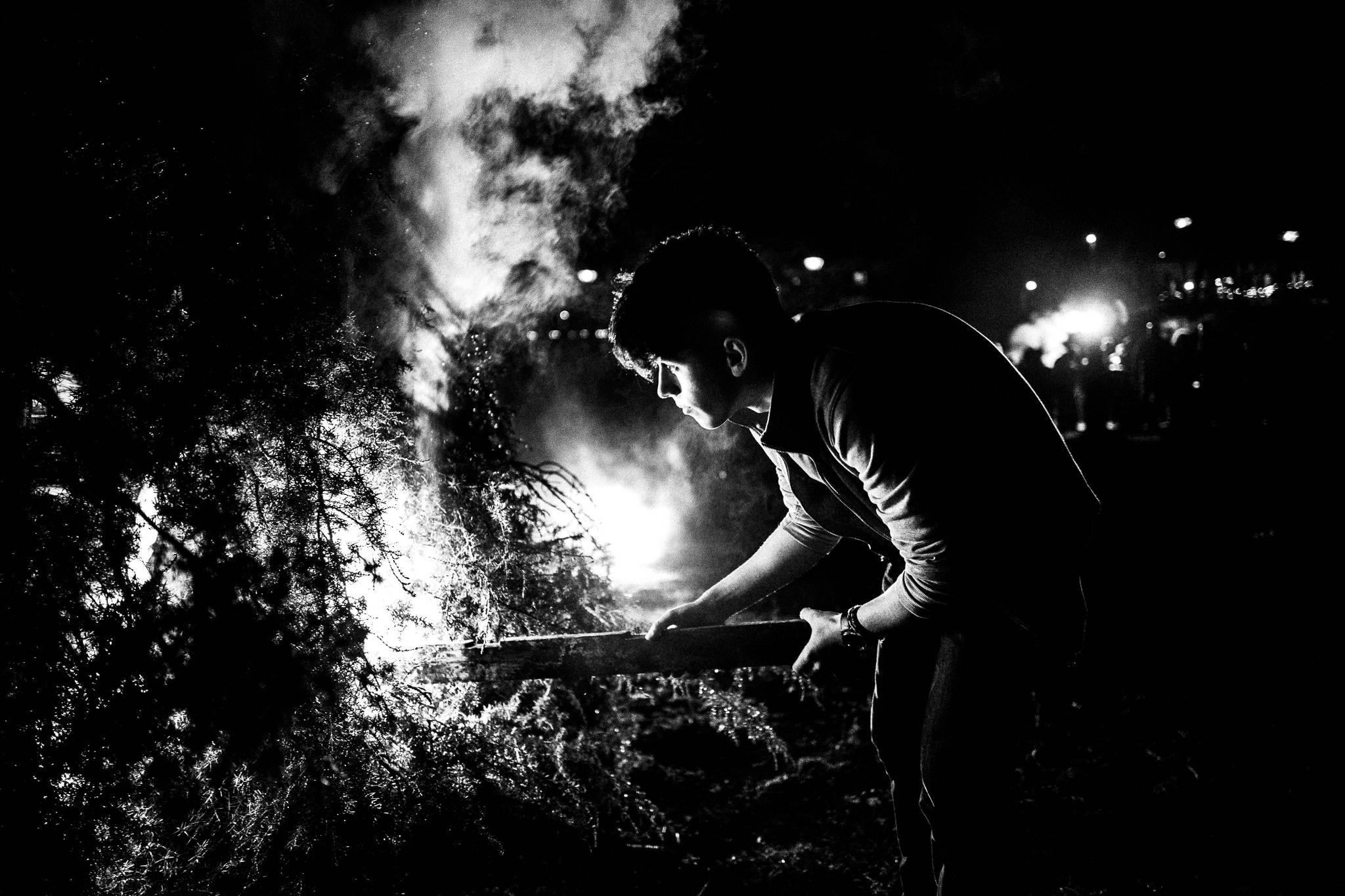 Lighting the bonfire, Pagan Christmas customs of Northern Greece, by photographer George Tatakis