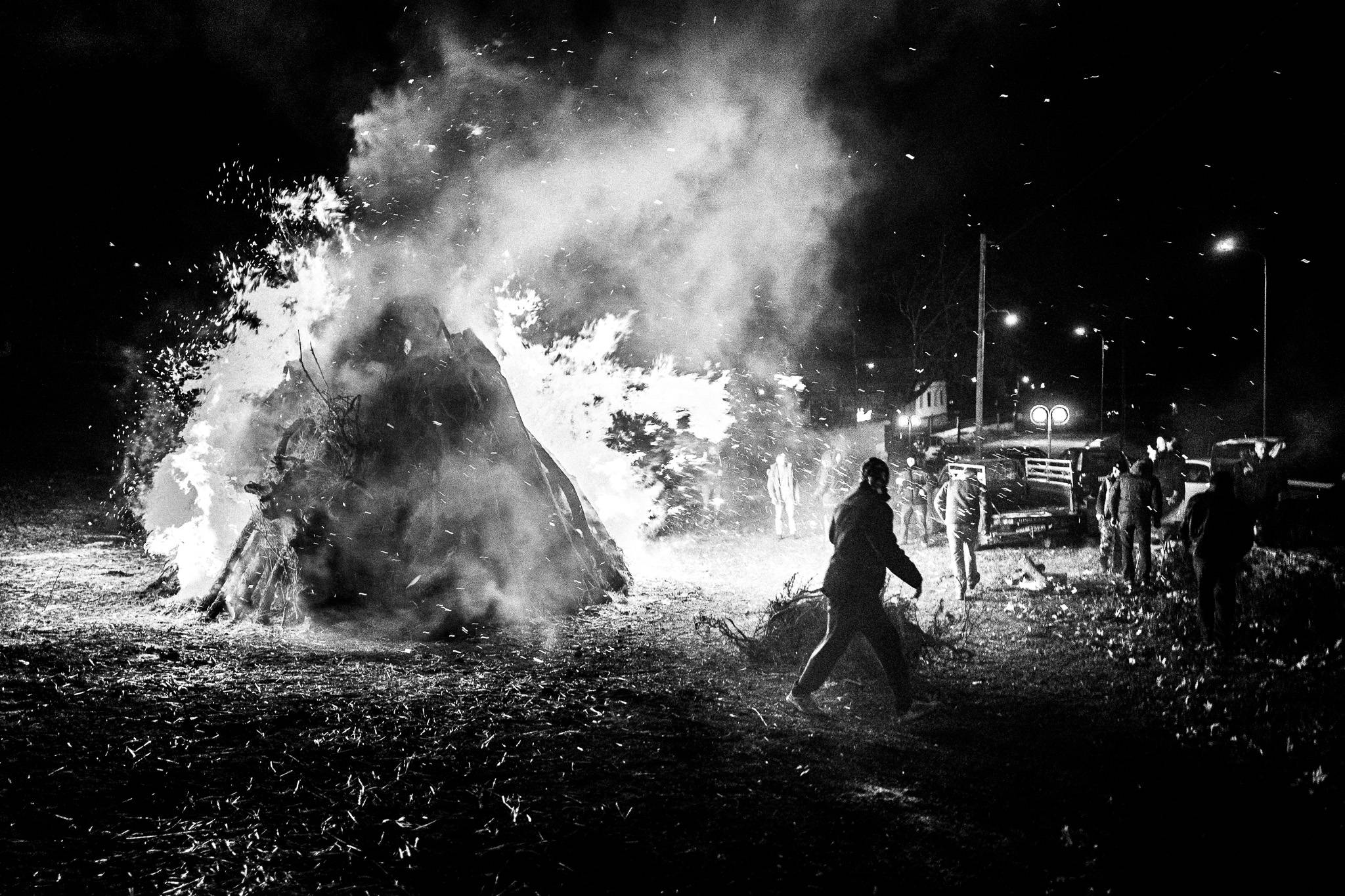 Enjoying the bonfire, Pagan Christmas customs of Northern Greece, by photographer George Tatakis