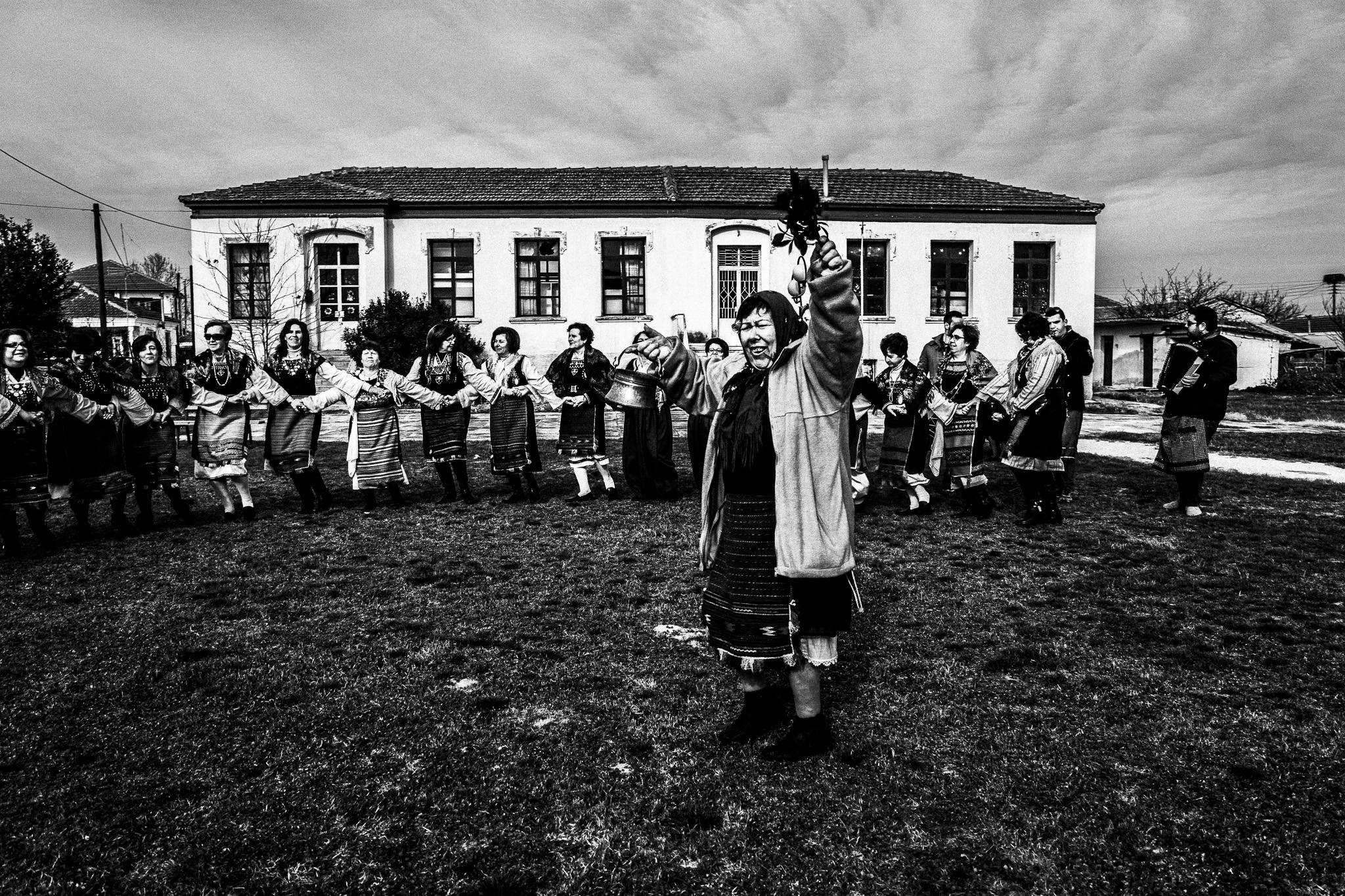 Dancing at a courtyard, Pagan Christmas customs of Northern Greece, by photographer George Tatakis