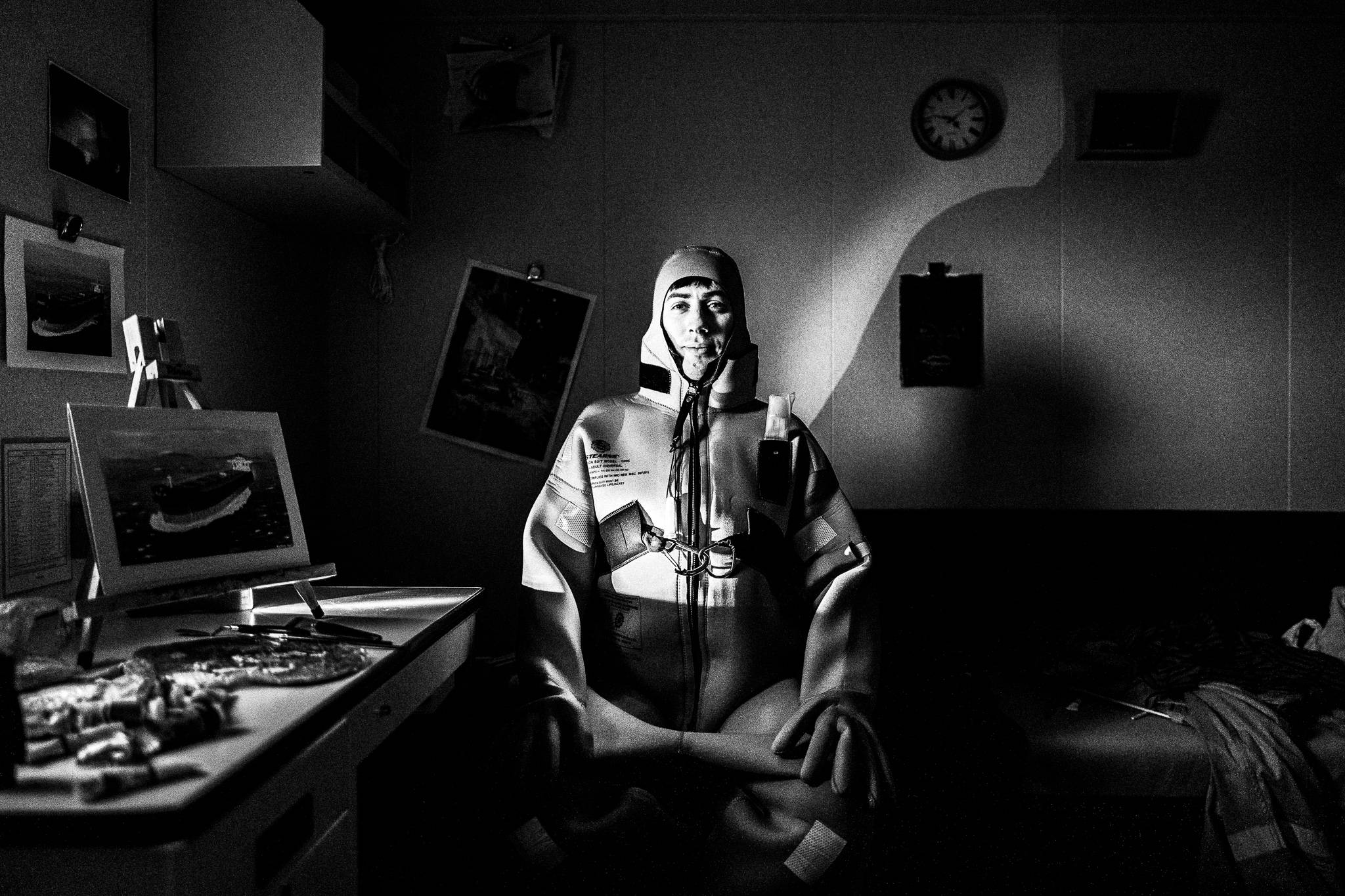 Anthony in his room, wearing the immersion suit, by photographer George Tatakis 
