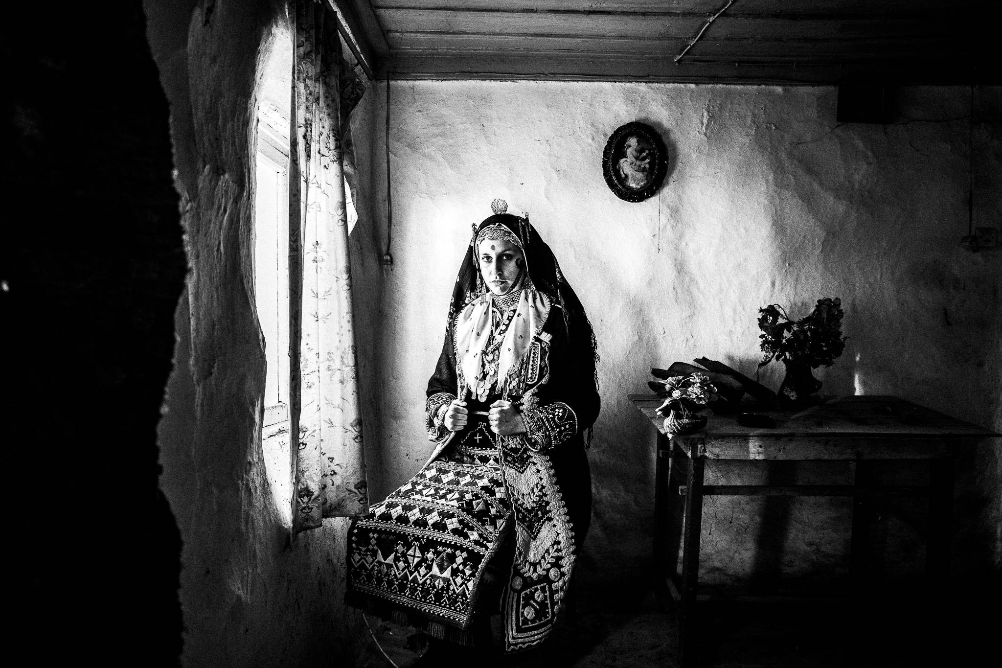 The local traditional costume inside a local house of Vrysses village, Evros, Thrace, Greece, by photographer George Tatakis