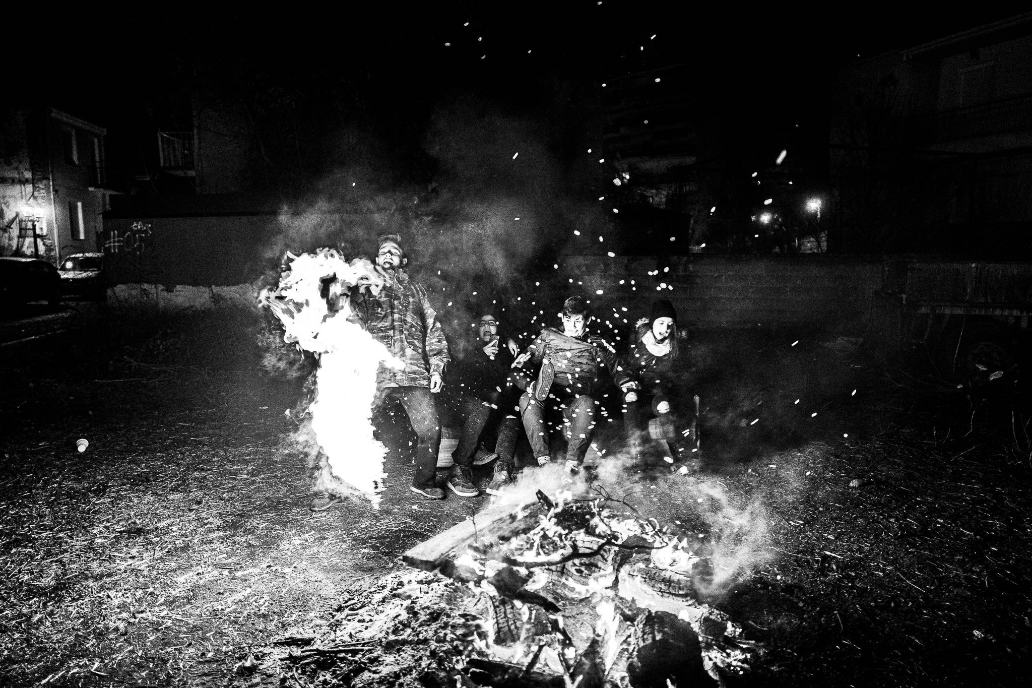 Kids enjoying the fire, Pagan Christmas customs of Northern Greece, by photographer George Tatakis