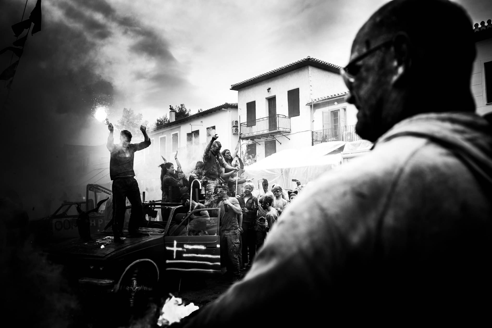 Flares, cars and dance at the flour wars in Galaxidi, by photographer George Tatakis