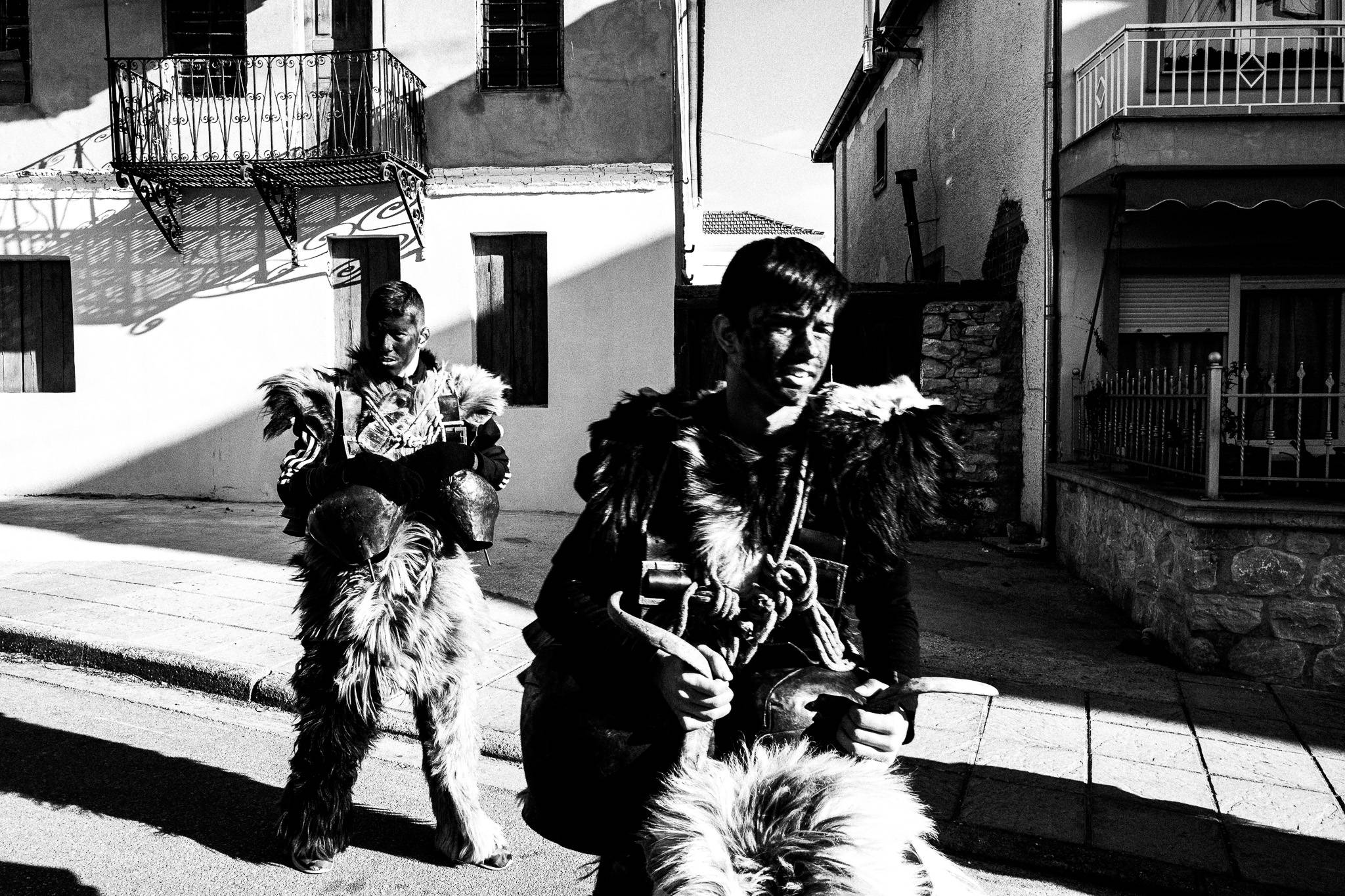 Arapides of Babiden round the streets of Petroussa, Pagan Christmas customs of Northern Greece, by photographer George Tatakis
