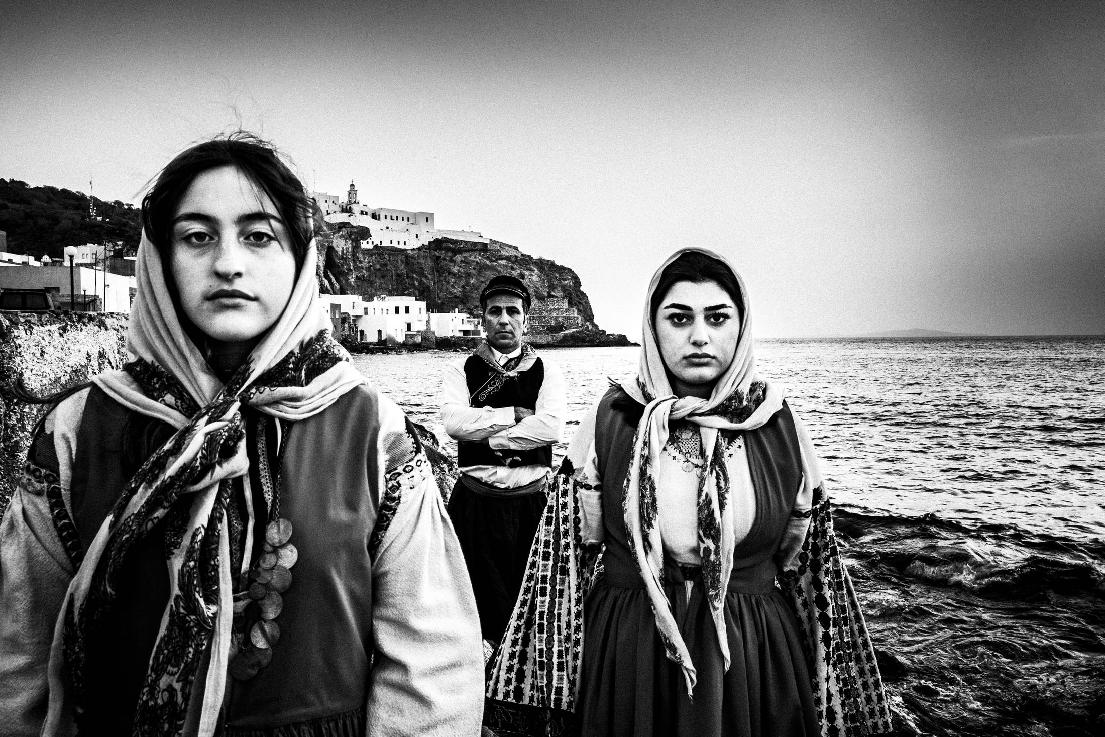 Traditional costumes of Nisyros at the old harbour, Dodecanese, Greece, by photographer George Tatakis