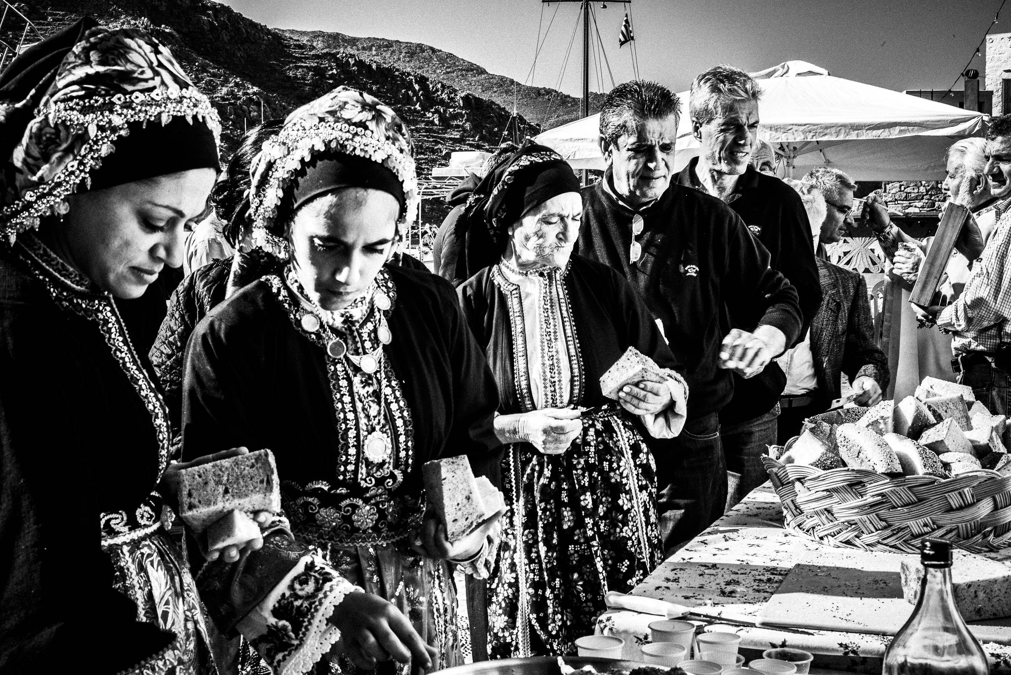The communion bread during the festival of Michael the Archangel at Tristomo, Olympos, Karpathos, Greece. Black and white photography by George Tatakis