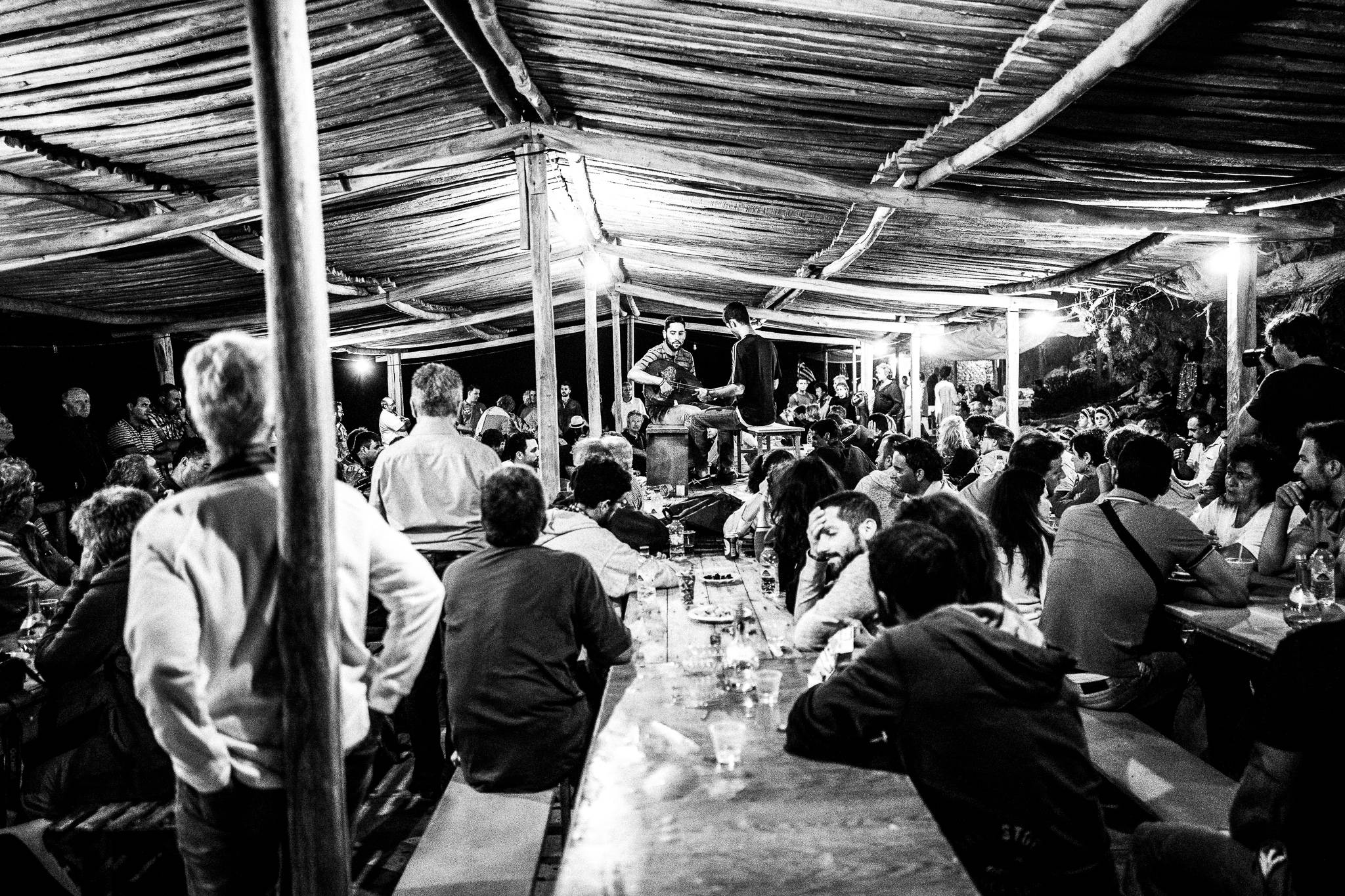The music starts at the feast of Saint John at the site of the ancient city of Brykous, Olympos, Karpathos, Greece. Black and white photography by George Tatakis