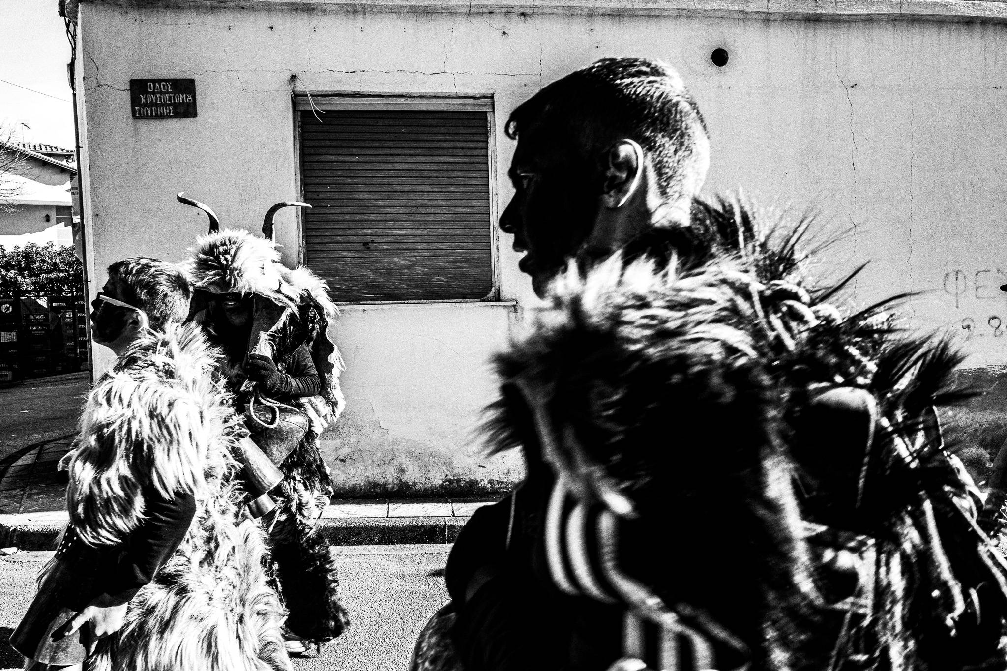 Arapides in the streets, Pagan Christmas customs of Northern Greece, by photographer George Tatakis