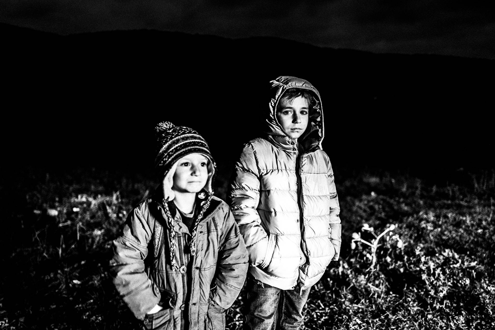 Kids enjoying the fire, Pagan Christmas customs of Northern Greece, by photographer George Tatakis