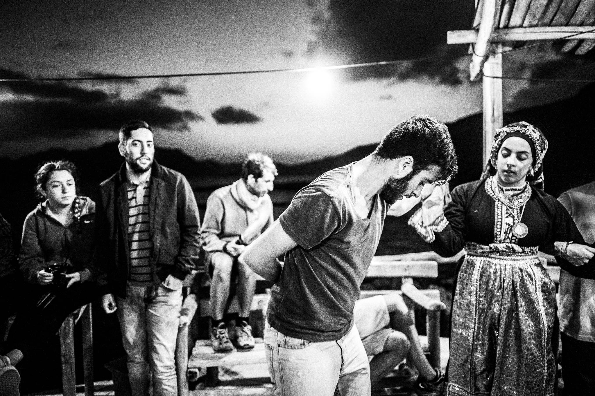 Pano Choros at the feast of Saint John at the site of the ancient city of Brykous, Olympos, Karpathos, Greece. Black and white photography by George Tatakis