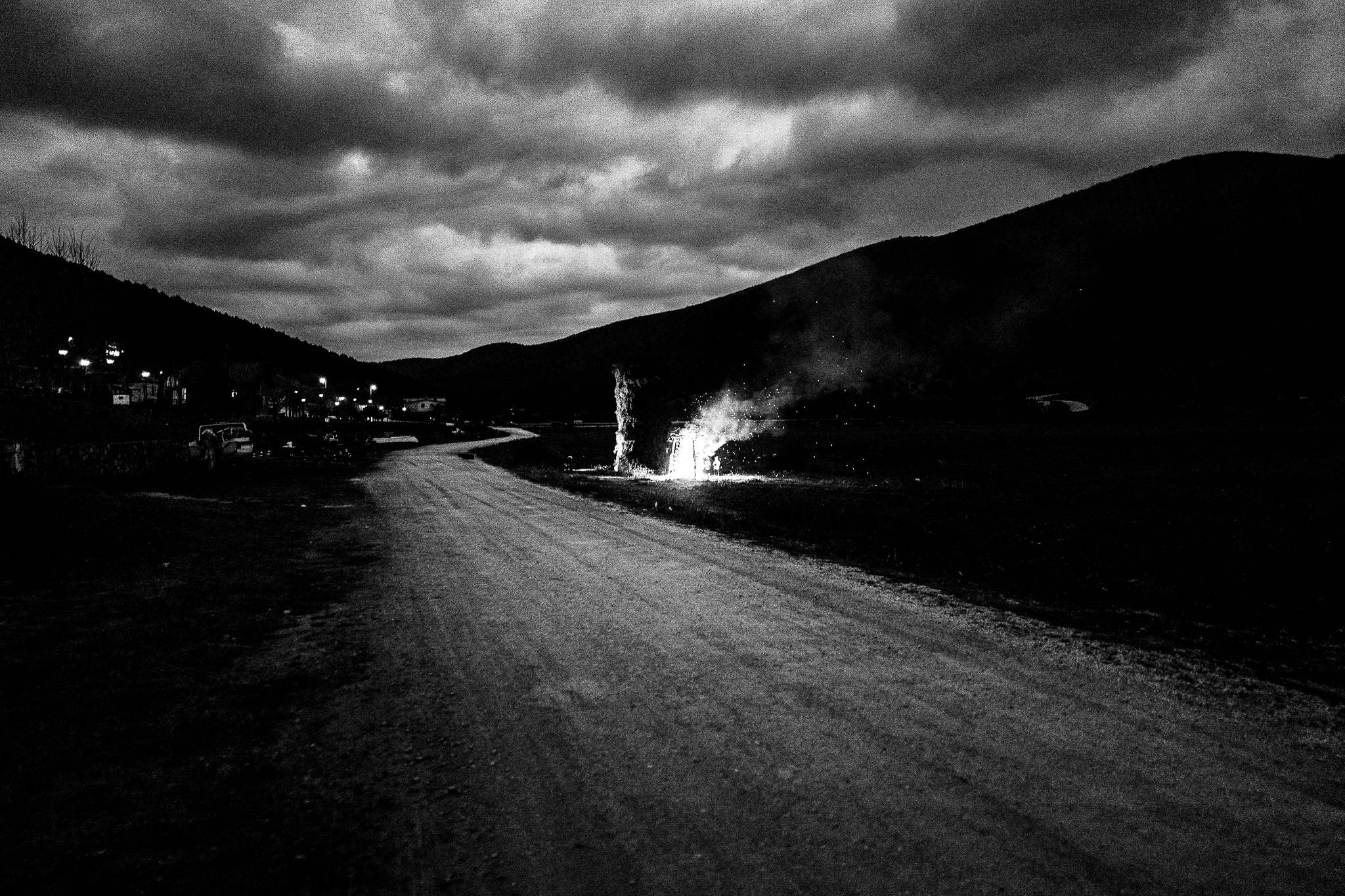 The smaller bonfire is lit, Pagan Christmas customs of Northern Greece, by photographer George Tatakis