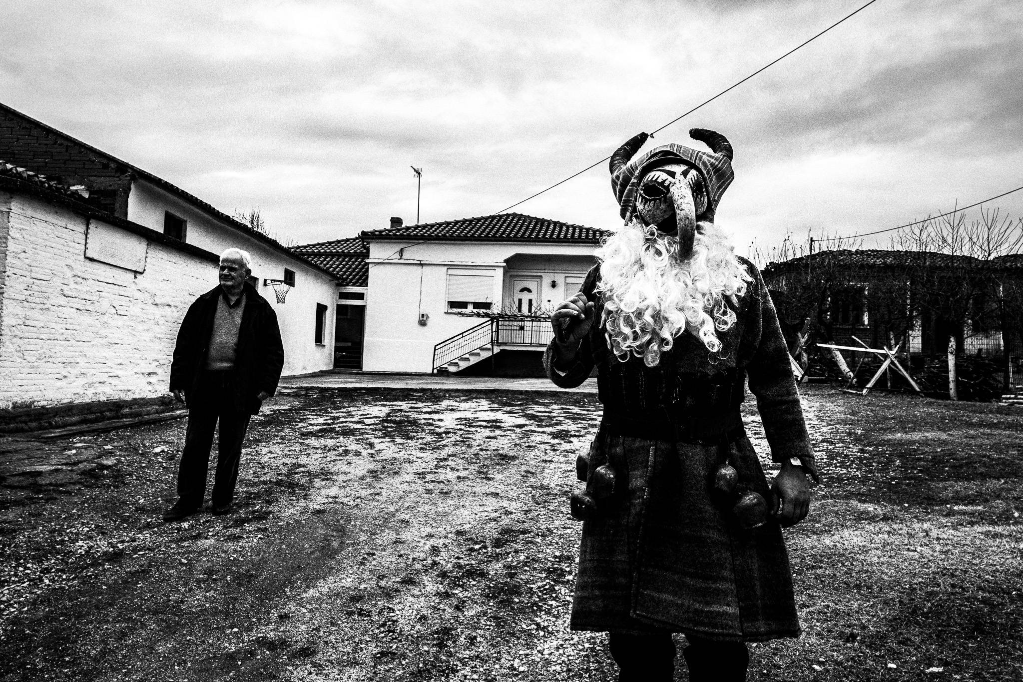 Purpuris visiting houses, Pagan Christmas customs of Northern Greece, by photographer George Tatakis