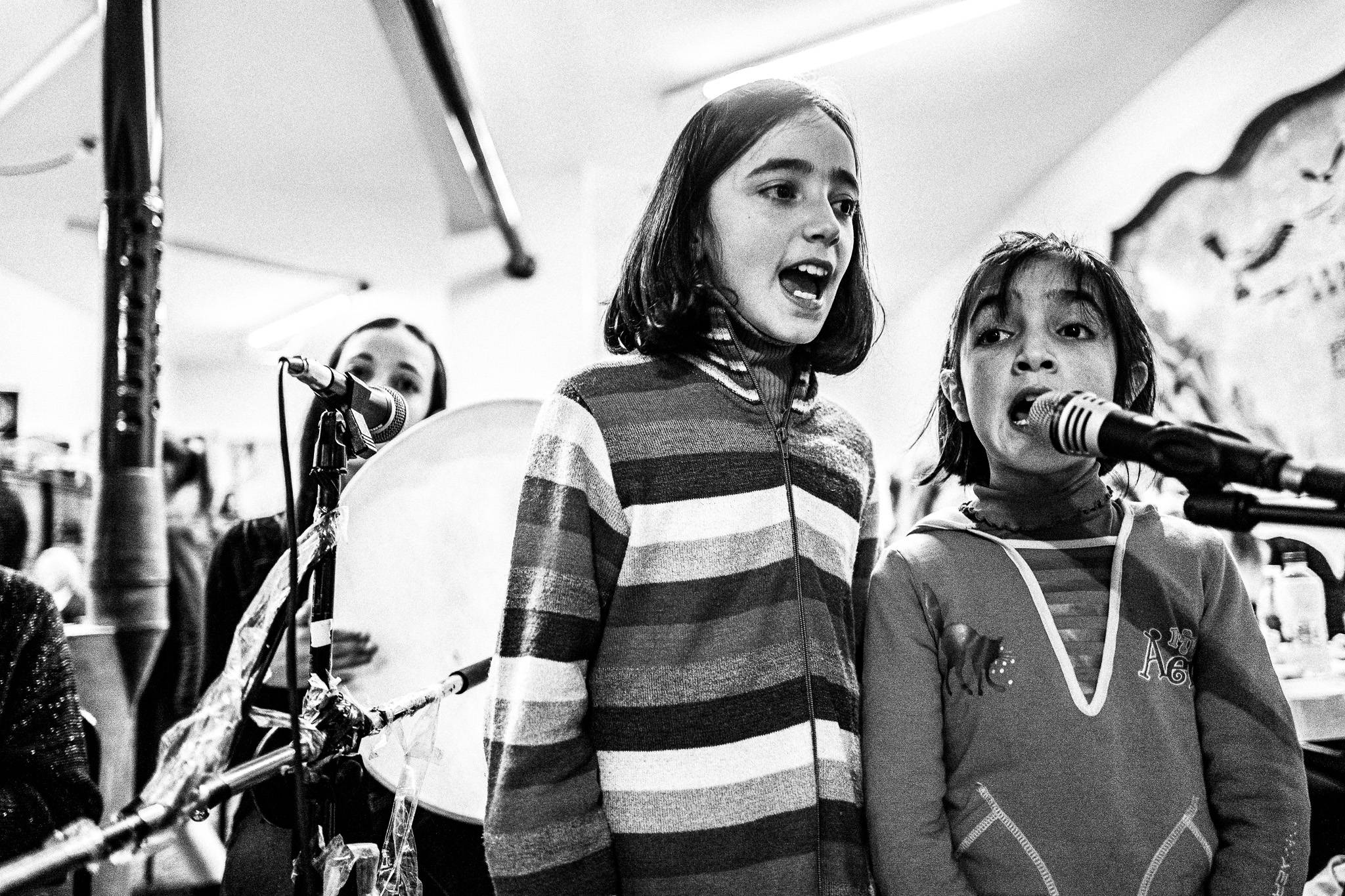 Girls singing folk songs at Pyrgi village, Pagan Christmas customs of Northern Greece, by photographer George Tatakis