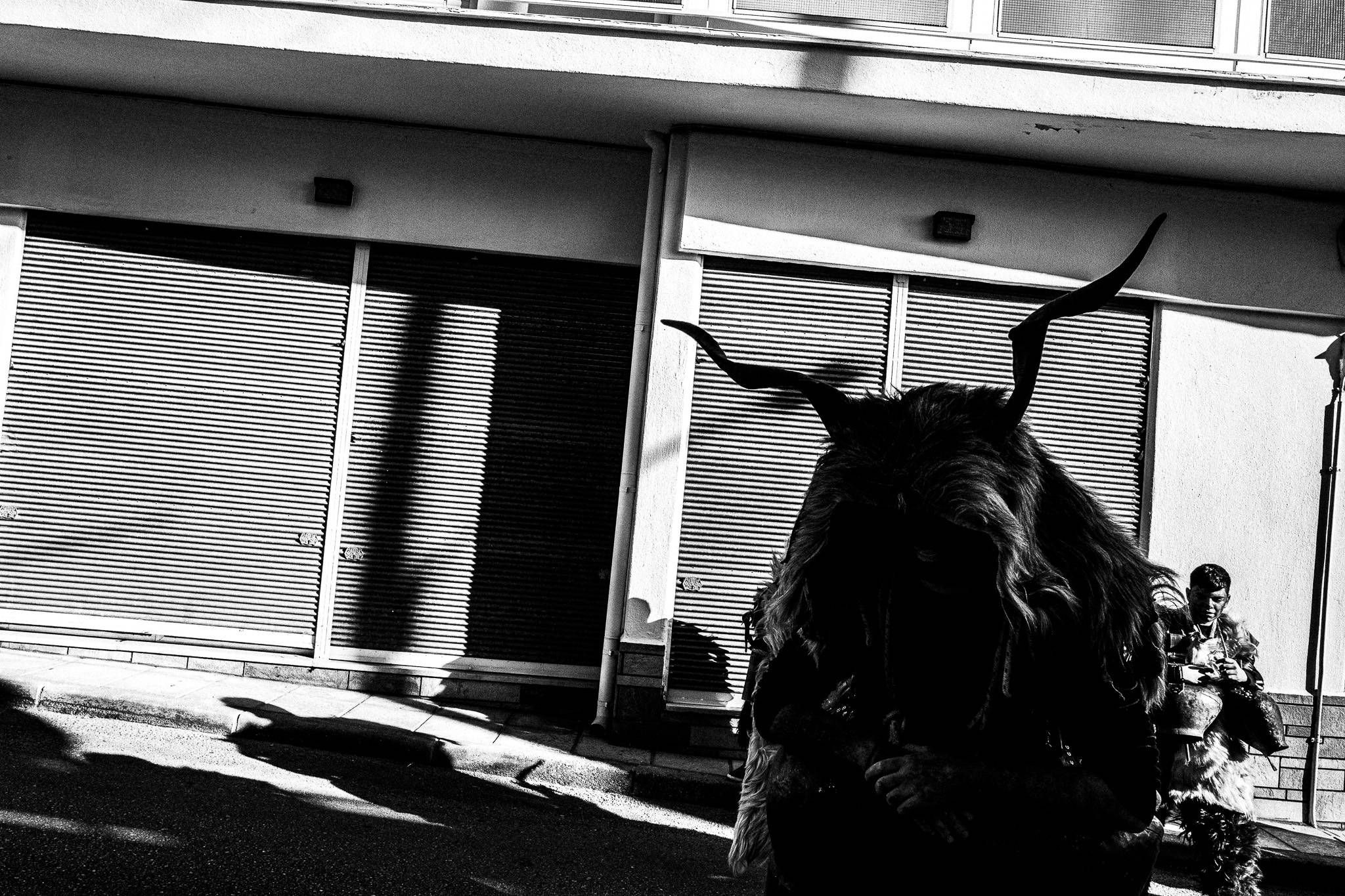 Arapides in the streets, Pagan Christmas customs of Northern Greece, by photographer George Tatakis