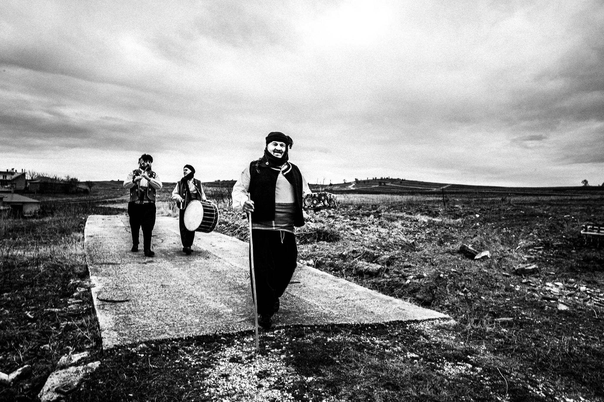 Musicians reaching the edge of the village, Pagan Christmas customs of Northern Greece, by photographer George Tatakis