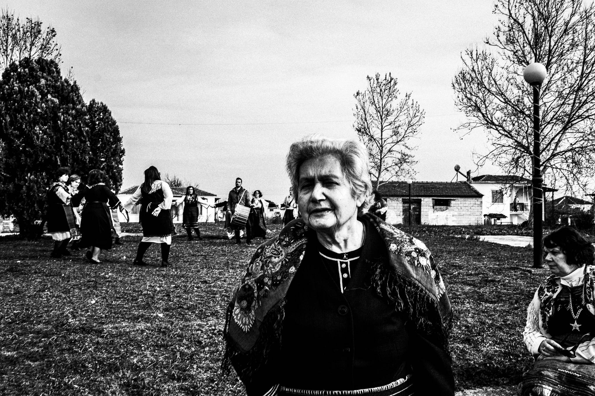Dancing at a local courtyard, Pagan Christmas customs of Northern Greece, by photographer George Tatakis