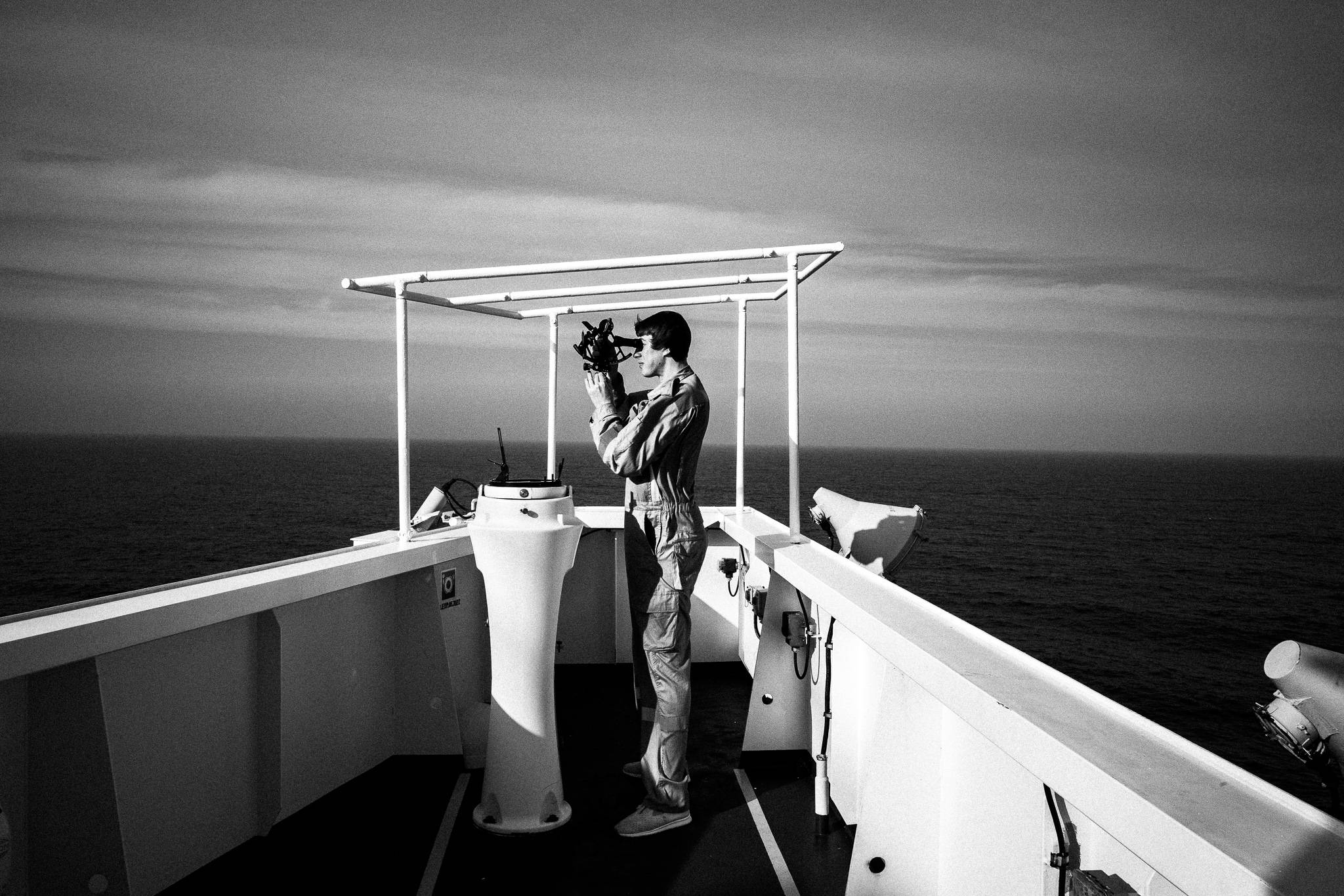 Anthony using the sextant on the deck, by photographer George Tatakis