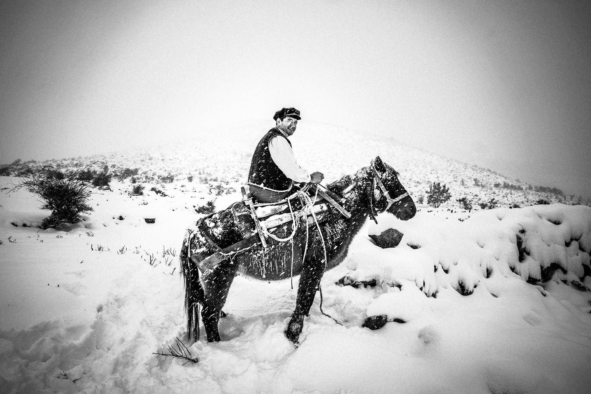 Yorgos on a donkey, Pagan Christmas customs of Northern Greece, by photographer George Tatakis