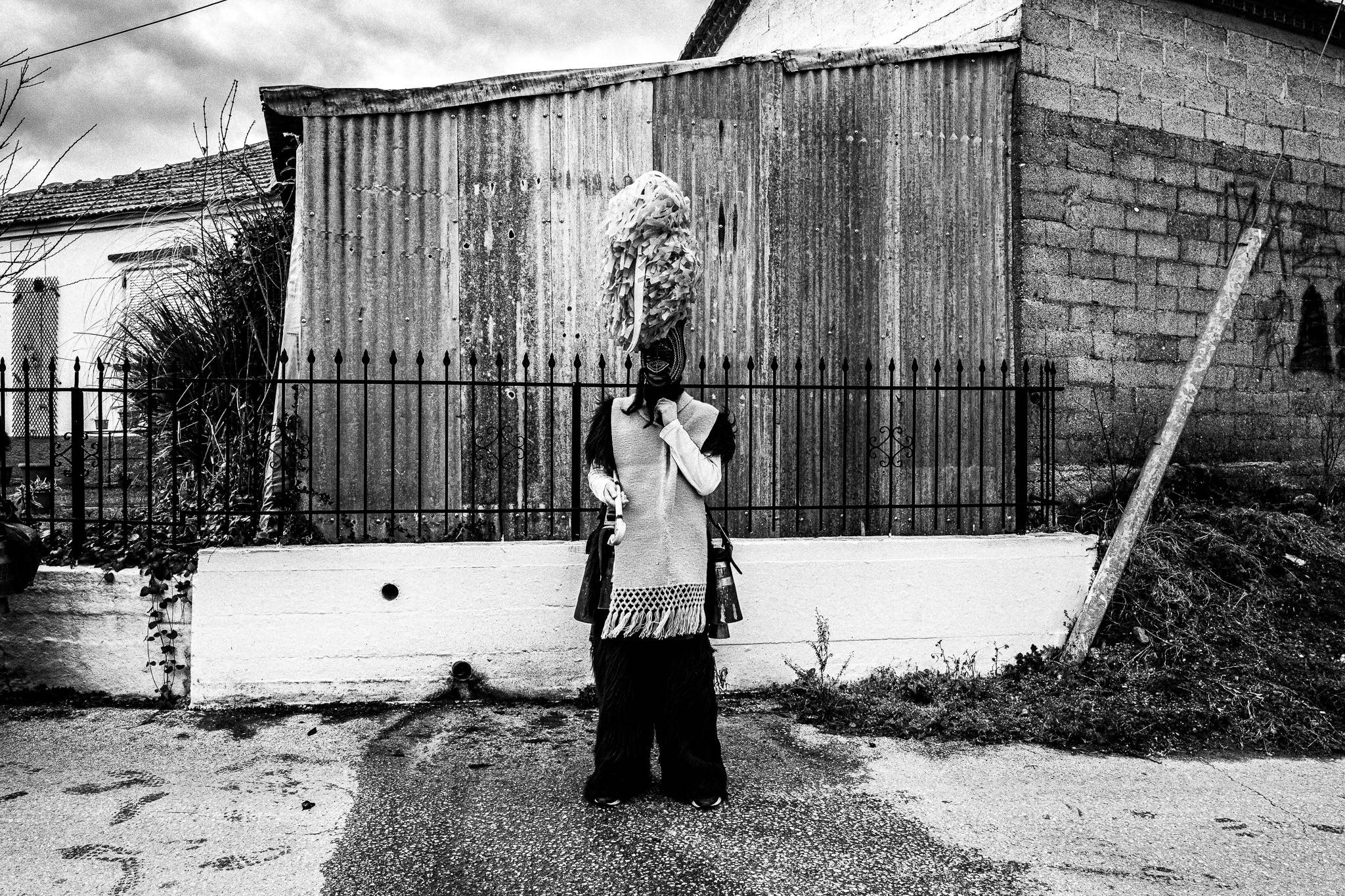 An Arapis of Profitis waiting for his company, Pagan Christmas customs of Northern Greece, by photographer George Tatakis