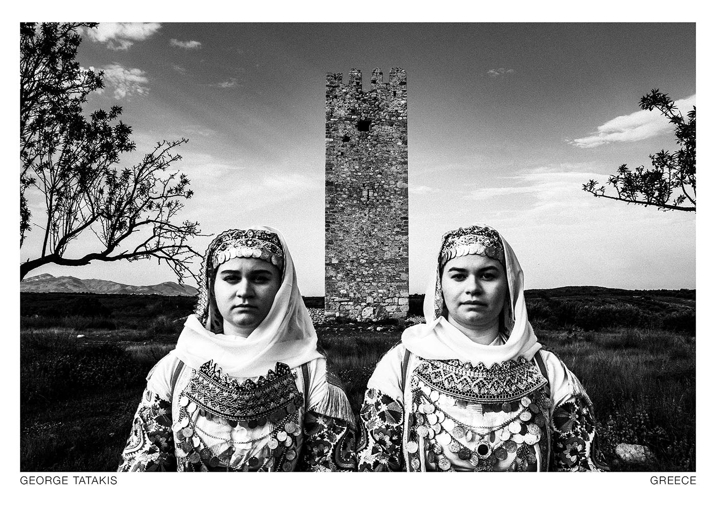 Two women wearing the local costumes of Markopoulo, Attica. Black and white photography postcard by George Tatakis, project Caryatis.