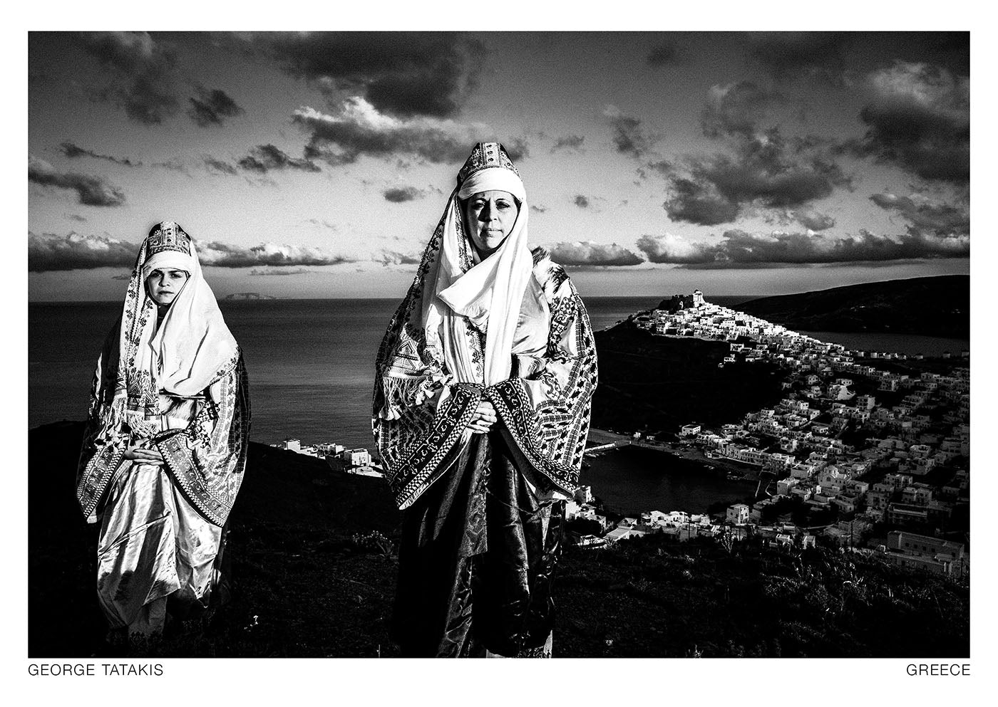 Two Women Overlooking the Castle, on the island of Astypalaea, Dodecanese, Greece. Black and white photography postcard by George Tatakis, project Caryatis.