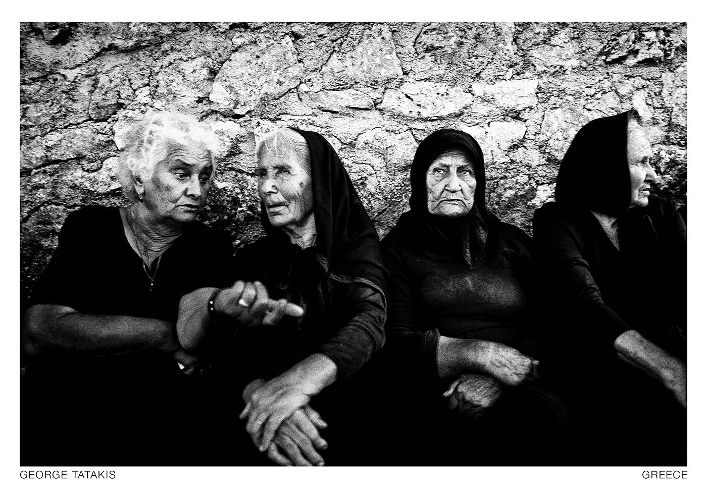 Four women during the celebration of Agios Donatos in Egglouvi, on the island of Lefkada, Ionian, Greece. Black and white photography postcard by George Tatakis, project Ethos.