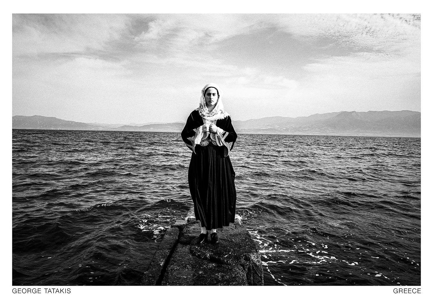 A woman wearing the local costume of Kymi on the island of Euboea, Attica Greece. Black and white photography postcard by George Tatakis, project Caryatis.