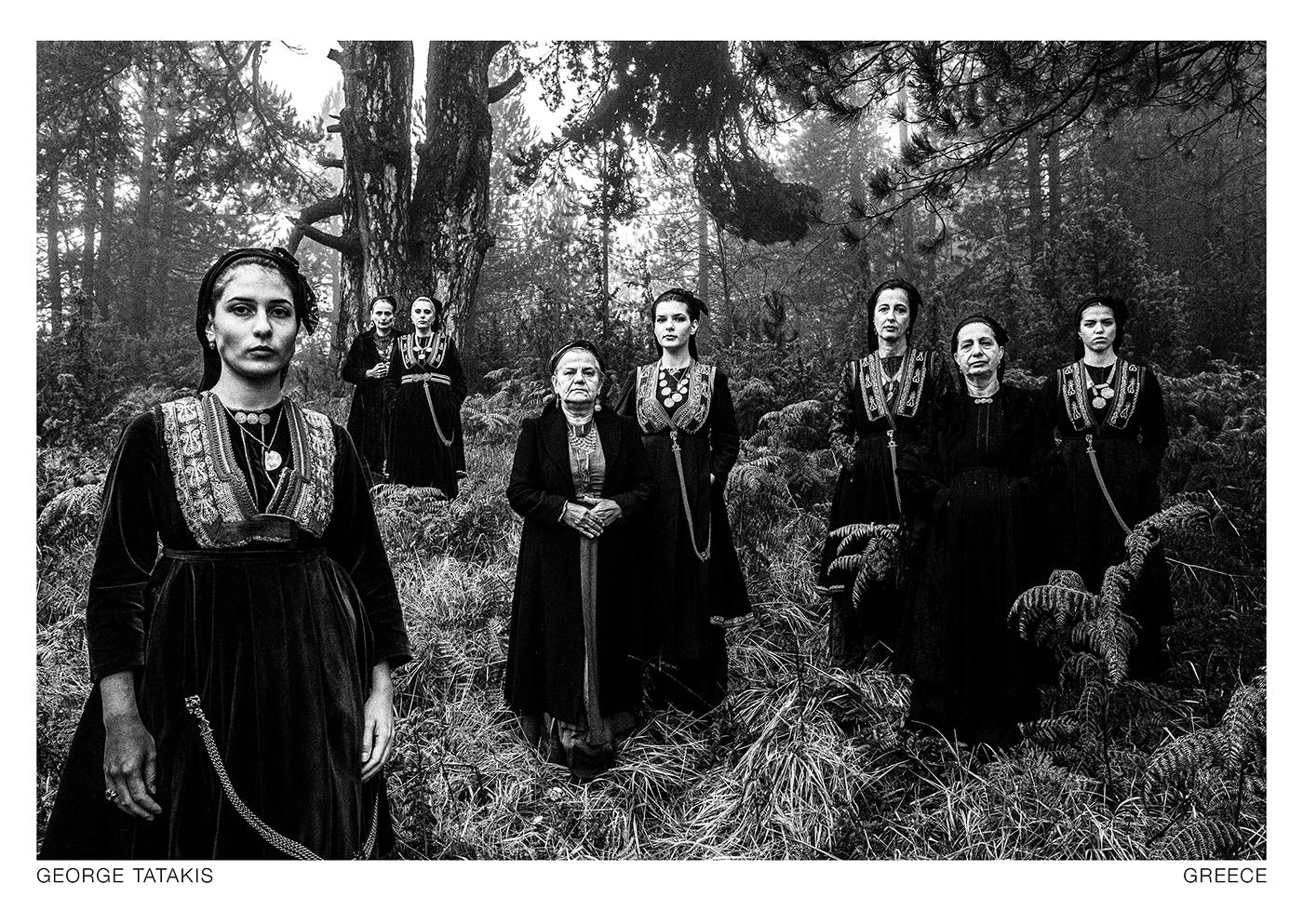 A group of women wearing the local vlach costumes, in Seli moutnain, Veria, Imathia, Macedonia, Greece. Black and white photography postcard by George Tatakis, project Caryatis.